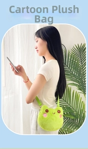 Detail of green plush frog crossbody bag featuring cute embroidery and adjustable strap