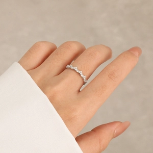 Minimalist s925 sterling silver crown ring with sparkling cubic zirconia on a finger