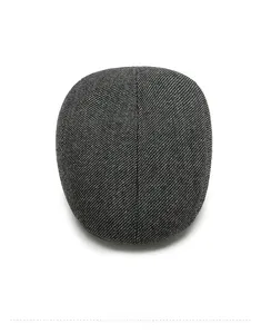 Top view of dark grey tweed winter hat showing texture and oval crown structure