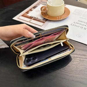 Elegant long black velvet wallet with gold zipper, featuring multiple slots and phone pocket