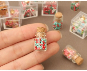 Miniature glass jars with red and green beads for DIY dollhouse Christmas decor