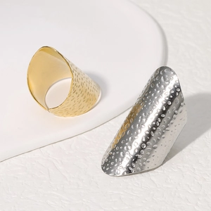 Chunky stainless steel rings with irregular hammered texture in gold and silver colors