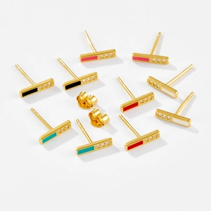 Macro view of colorful enamel bar earrings in gold finish with micro-inlaid zircon stones