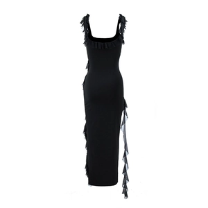 Detail of black slim fit dress with ruffle straps and side split mesh streamer design