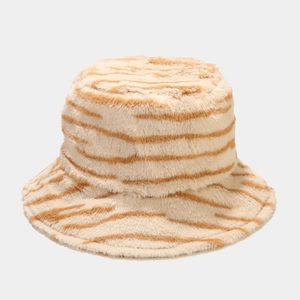 Detailed close-up of fluffy faux fur texture on a striped brown winter bucket hat