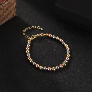 Three-tone beaded bracelet in gold, silver, and rose gold with adjustable lobster clasp