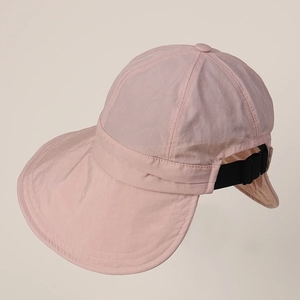 Detail view of pink nylon sun hat with wide brim and adjustable buckle strap