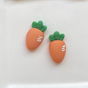 Pair of orange resin carrot charms with green leaves for DIY hair clips and crafts