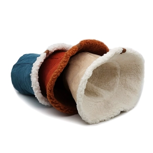 Detail of stacked corduroy bucket hats featuring warm fleece lining and thick texture