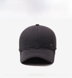 Front view of men's knitted baseball cap featuring a silver logo and thick winter texture