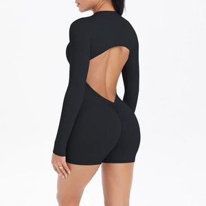 Detail view of backless black athletic jumpsuit featuring scrunched booty lifting design