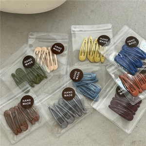 Detail view of colorful matte water-drop BB clips sets in various retro candy colors
