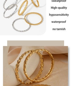 Detail showing sweatproof high-quality gold and silver heart-textured bracelets