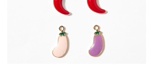 Macro shot of colorful enamel alloy chili and eggplant charms for DIY jewelry making