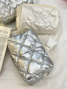Quilted heart cosmetic bags set in silver and cream waterproof puffer style fabric