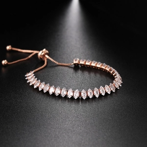 Detail of rose gold marquise-cut crystal tennis bracelet with adjustable slider clasp