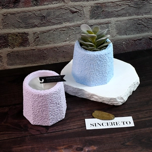 Octagonal concrete candle cup and succulent planter mold with industrial texture