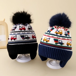 Winter knit hats for kids featuring excavator patterns, warm earflaps and faux fur pom-poms