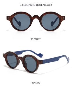 Vista detallada de gafas de sol redondas de leopardo con patillas azules y remaches