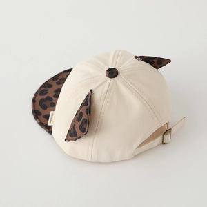 Detail of baby baseball cap featuring leopard print ears and vintage metal adjustment buckle