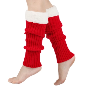 Close-up of red knit leg warmer with white faux fur trim on model's leg over white background