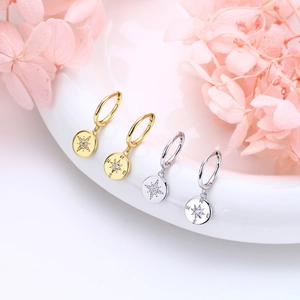 Elegant S925 sterling silver compass star hoop earrings in gold and silver finish