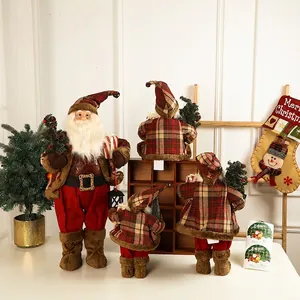 Vintage European Santa figurines in red and brown plaid coats for festive home decor