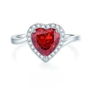 Macro detail of S925 sterling silver ring featuring a red heart-shaped gemstone and zircons