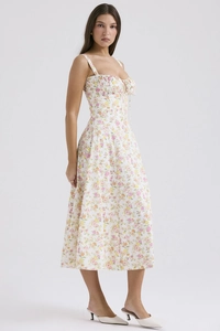 Detail shot of drawstring ruching and floral print on a summer camisole midi dress