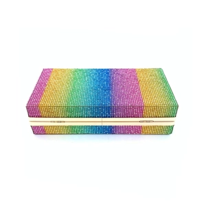Detail of colorful rainbow rhinestone clutch bag with elegant golden metal frame