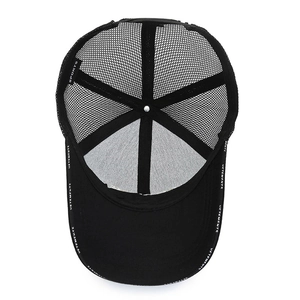 Breathable black mesh trucker hat with white Vetements branding on the brim and internal tag