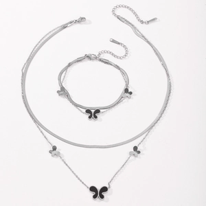 Detail of silver double-layered snake chain set with black butterfly charms