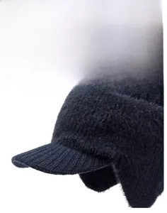 Detail showing knit texture and warm plush ear protection on navy winter hat