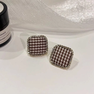 Houndstooth square fabric stud earrings with zircon inlay on a minimalist background