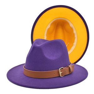 Detail of purple fedora hat with yellow lining and brown leather belt buckle