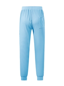 Detailed back view of light blue waffle knit pants featuring texture and back pocket