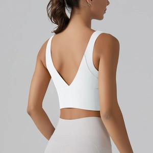 Detail view of the V-shaped back design on a white high-stretch sports yoga bra