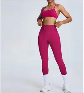 Detailed view of high-waisted hot pink yoga pants featuring high elasticity and breathable fabric