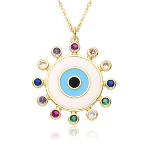 Golden sunburst evil eye necklace with colorful zircon gemstones on a white background