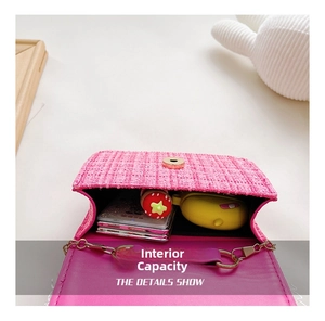 Detail view showing internal capacity of the pink tweed girls crossbody bag