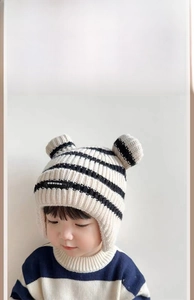 Detail of fleece lining and knit texture on baby winter hat with bear ears