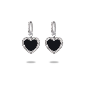 Detailed view of silver heart earrings with sparkling diamonds and black center accent