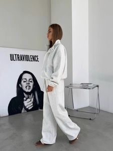Minimalist two-piece loungewear set featuring oversized zip-up hoodie and wide-leg trousers