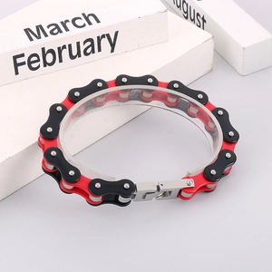 Macro view of bike chain bracelet in red and black stainless steel industrial design