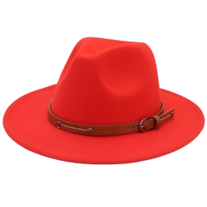 Detail of red wool felt jazz hat featuring a brown leather belt with metal buckle