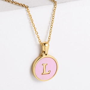Golden necklace with a round pink shell pendant featuring a gold letter L initial