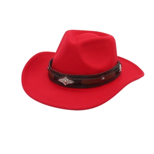 Detail of red cowboy hat with dark brown leather band and silver engraved metal hardware