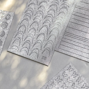Silver glitter butterfly nail stickers with French stripes and sparkle star designs