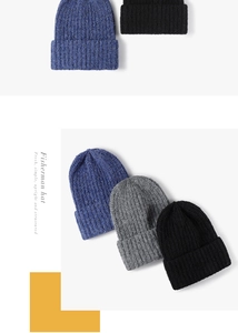 Detailed knit texture of thick beanie hats in navy blue, light grey, and black colors