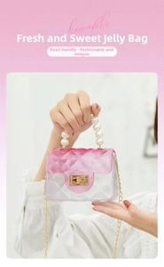 Close-up of pink gradient jelly bag with diamond lattice pattern and pearl handle